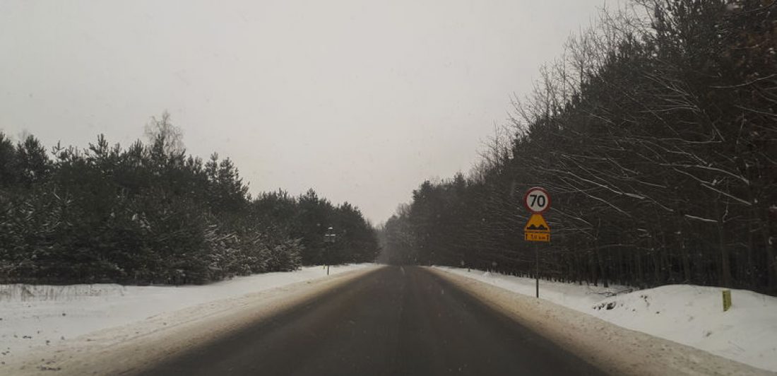 view of the road from the car in winter. View from the driver’s perspective Image of a snowy road