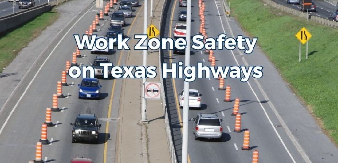 Traffic moving through a highway work zone in Texas with orange construction barrels, temporary barriers and reduced lanes.